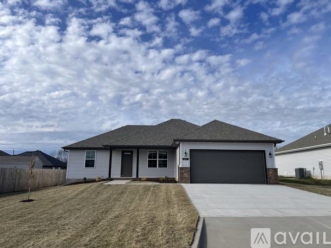 A house with a garage is available for sale.
