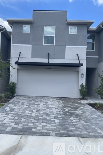 A modern house with a garage and a driveway.