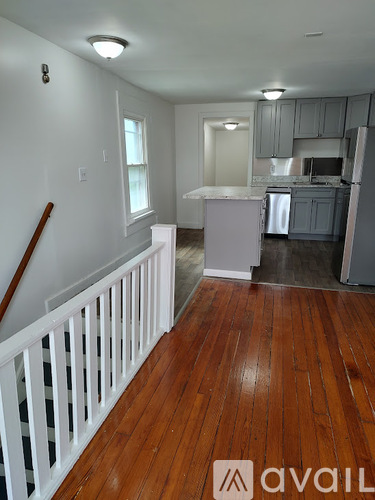 A room with wooden floors and white walls.
