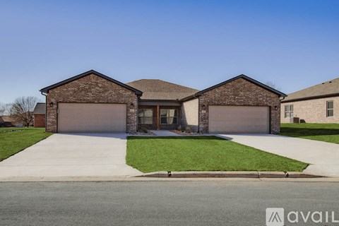 A house with a garage is available for sale.