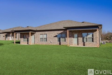 A house with a lawn in front of it is available for sale.