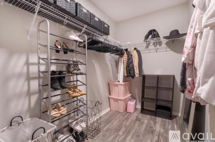 A shoe rack with multiple pairs of shoes and a shoe organizer.