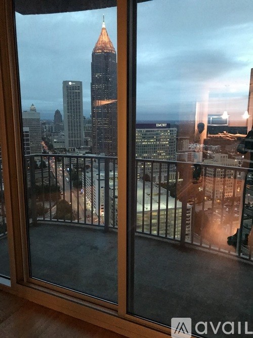 A view of a city skyline from a window.