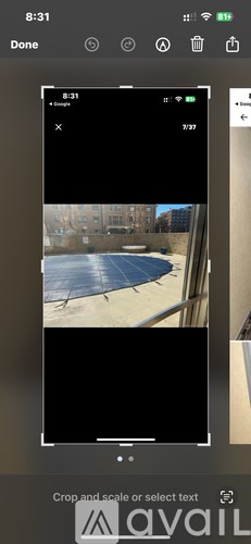 A smartphone screen displays a photo of a swimming pool.