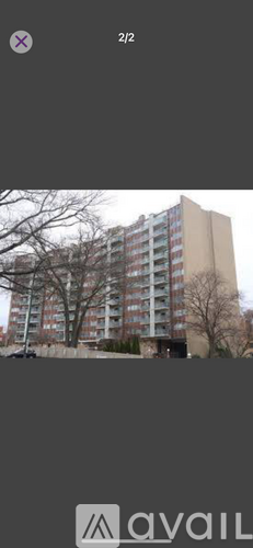 A tall building with multiple windows and balconies.