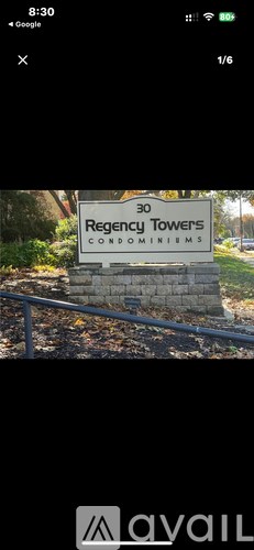 A sign for Regency Towers Condominiums is displayed.