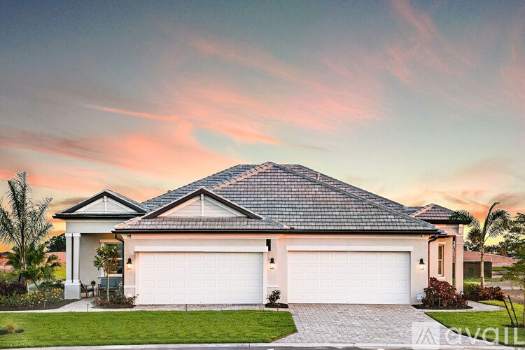 A house with a white garage door is for sale.