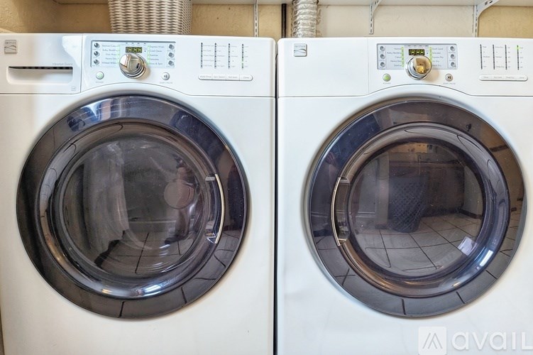 Two front load washing machines are shown.