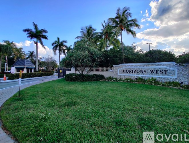 A sign that says Horizons West is in front of some trees.