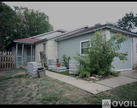 A purple door is on the right and a window is on the left.