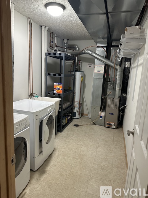 A laundry room with a washer and dryer in it.