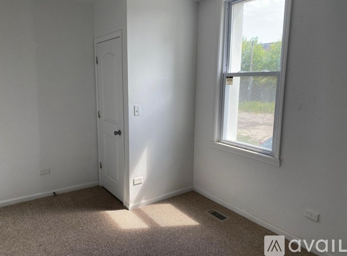 A room with a door and a window.