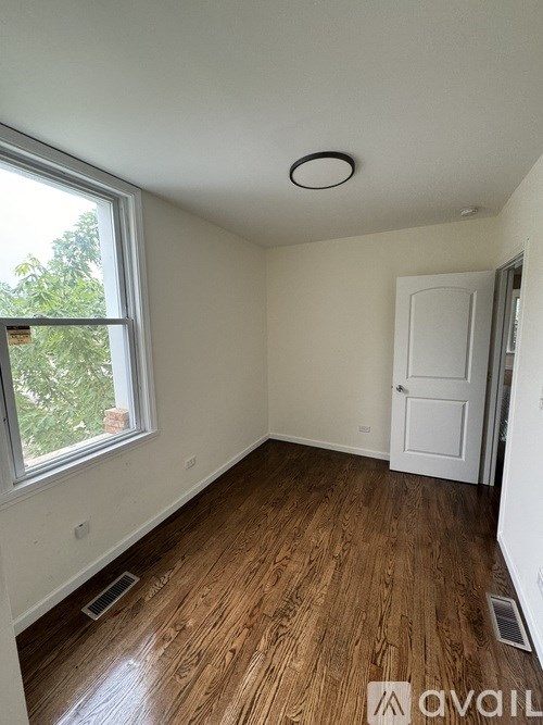 A room with a window and a door.