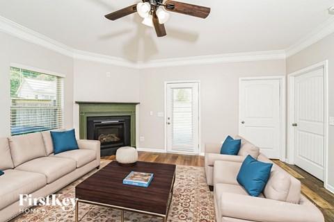 A living room with a fireplace and a couch.