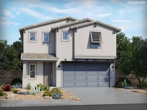 A modern house with a grey garage door and a brown door.