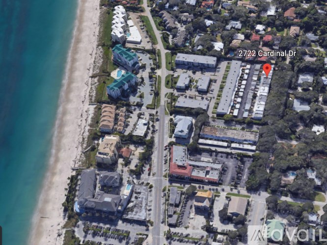 An aerial view of a beachfront area with a building at 2722 Cardinal Dr.
