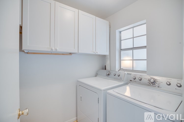 A laundry room with a washer and dryer.