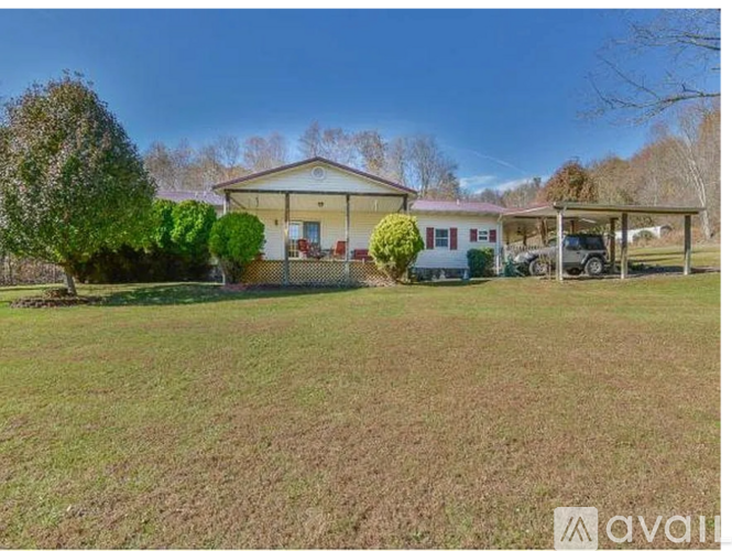 A house with a lawn in front of it is for sale.