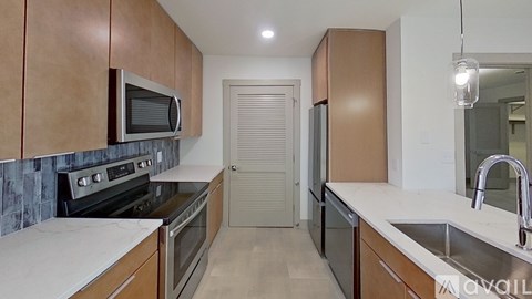A kitchen with wooden cabinets and a white countertop.