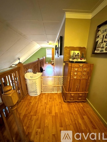 A kitchen with wooden cabinets and a table.