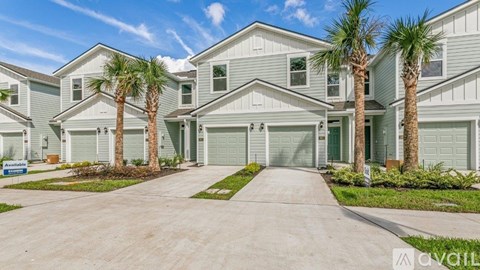 A row of houses with a sign that says "available" in front of them.