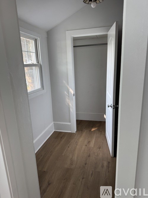 A room with a door and a window.