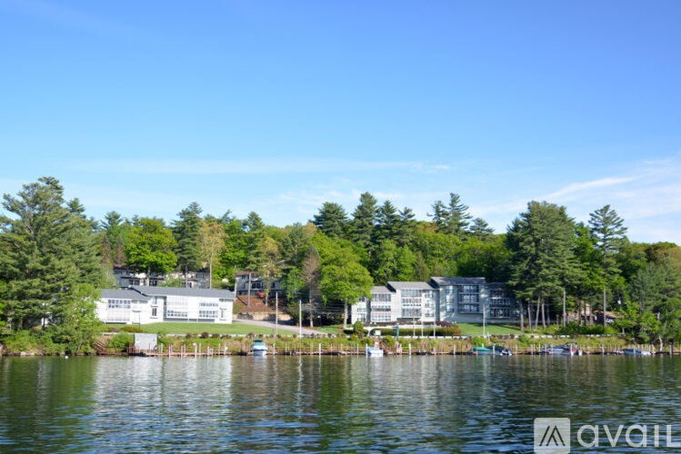 A serene lake with a building in the background.