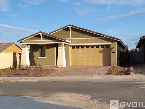 A two-story house with a garage is available for sale.