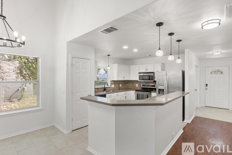 A modern kitchen with a large island in the middle.