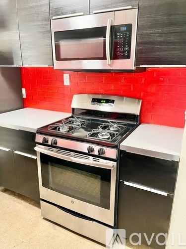A modern kitchen with a stove and oven.