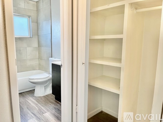 A bathroom with a toilet and a walk-in shower.