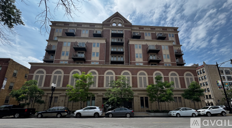 A large building with a parking lot in front of it.