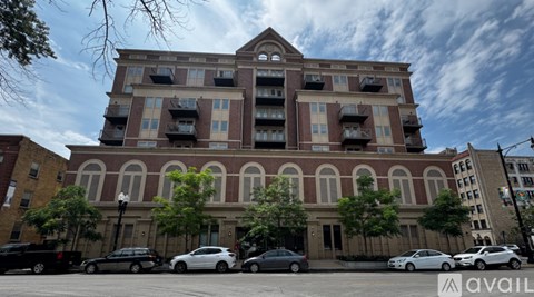 A large building with a parking lot in front of it.