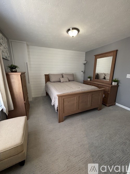 A street view of a residential area with a house and a street lamp.