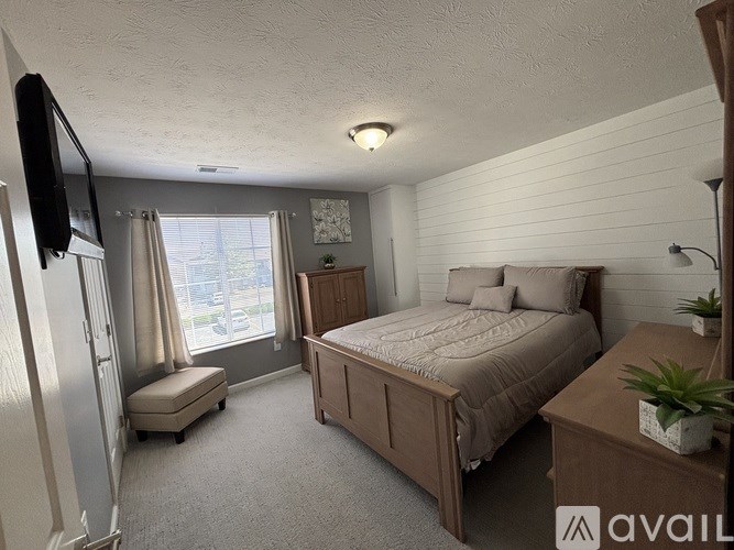 A balcony with a railing and a window with a yellow sign on it.