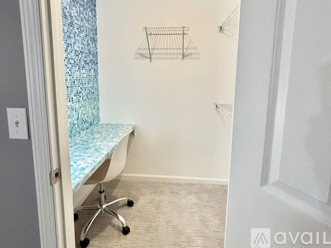 A bird's eye view of a residential area with houses and greenery.