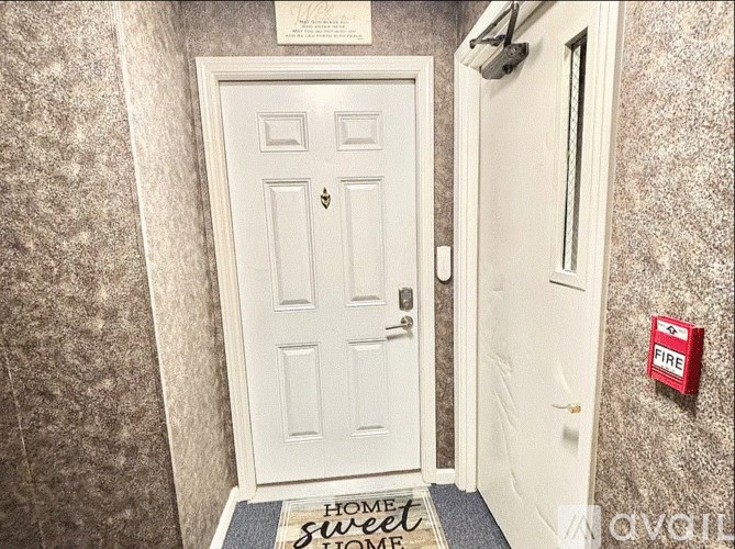 A staircase with blue carpeted steps and white railings.