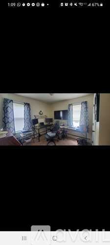 A room with a desk and a chair.