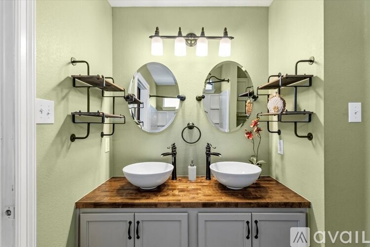 A wooden bench with a Chevrolet sign sits on a wooden deck.