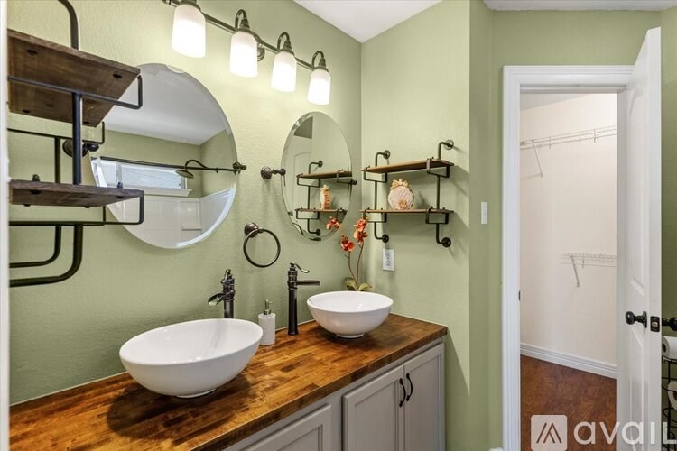 A bird's eye view of a residential area with houses and cars.