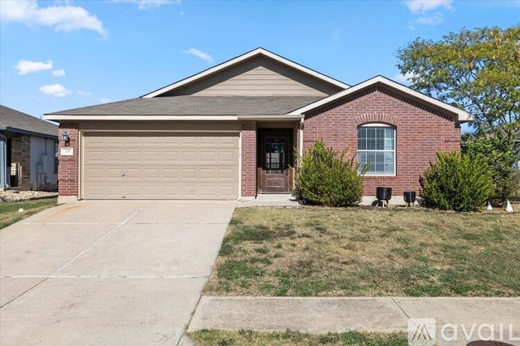 A bedroom with a bed, dresser, and television.