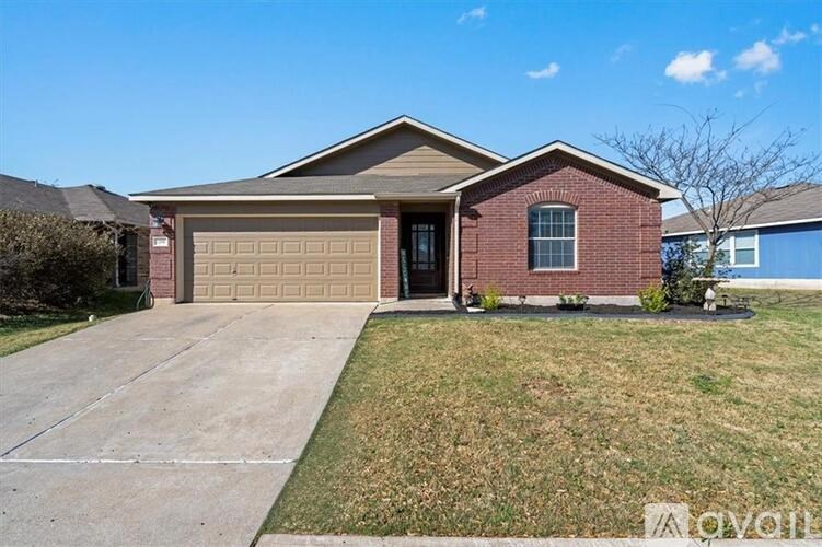 A house with a brown garage door is for sale.