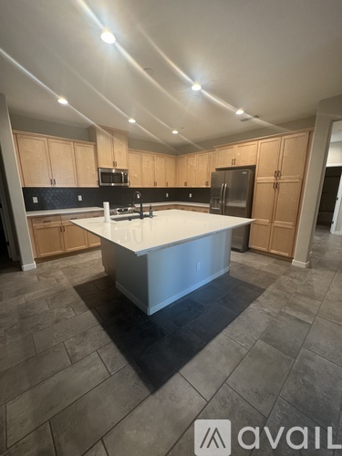 A kitchen with a large island in the middle of the room.
