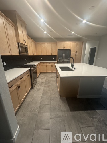 A kitchen with wooden cabinets and a white countertop.