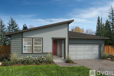 A house with a garage and a red door is for sale.