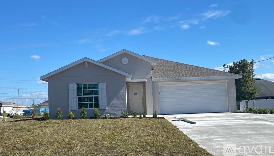 A two-story house with a garage is for sale.