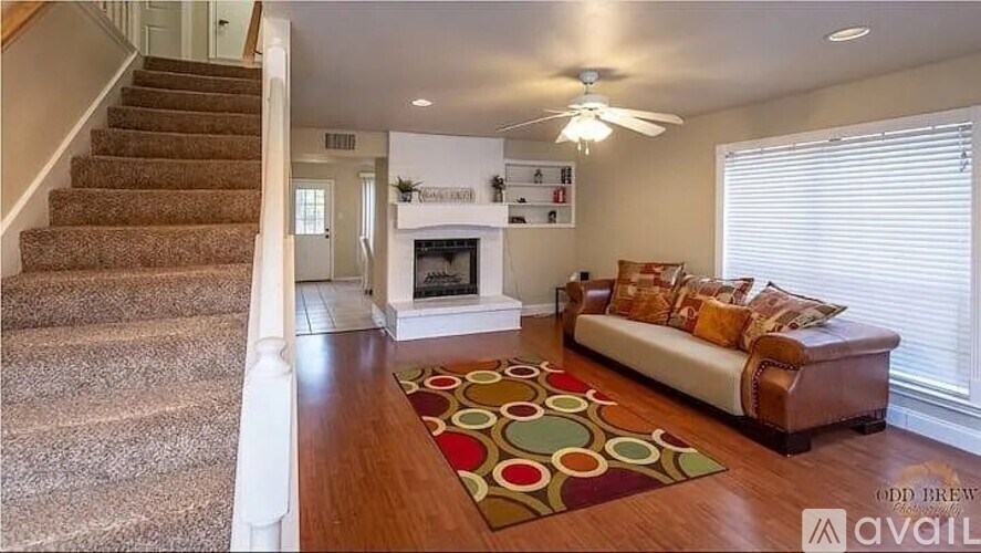A living room with a fireplace and a couch.