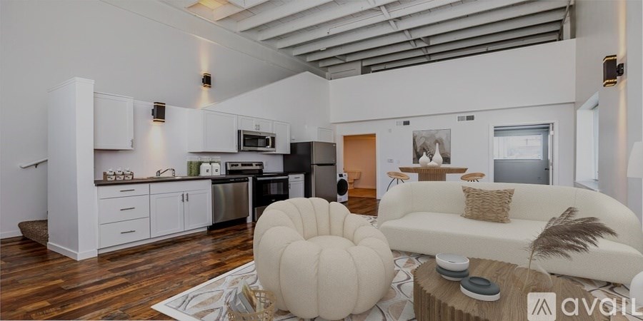 A modern kitchen with white cabinets and a large island.