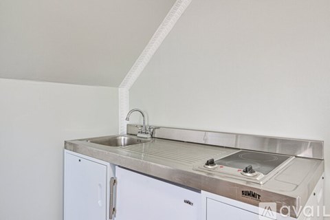 A kitchen with a Summit stove top oven.