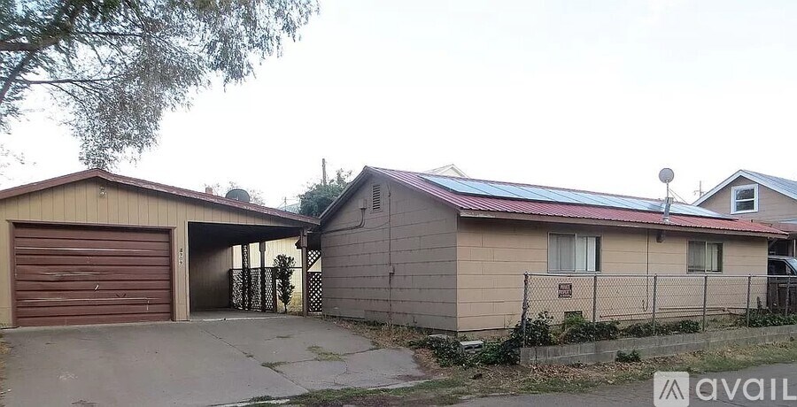 A house with a garage is available for rent.